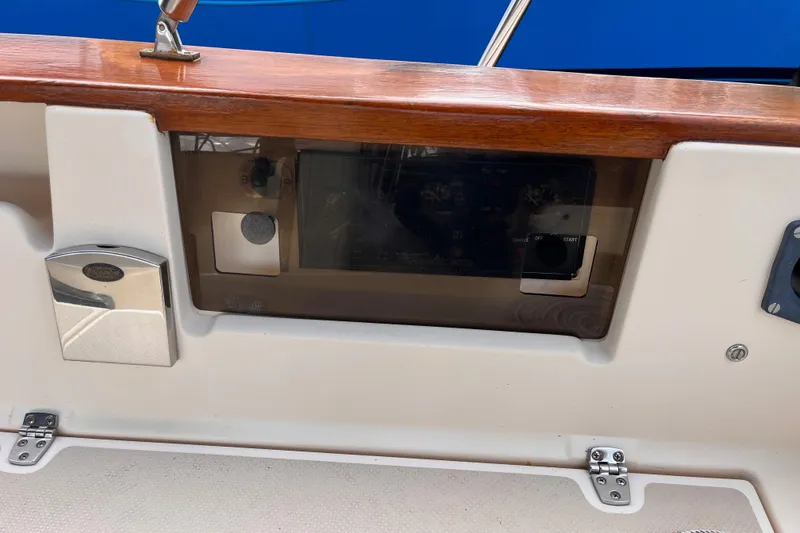 Slide: The Image of Control panel of a 2000 Island Packet 350 sailboat with wooden trim. - 22
