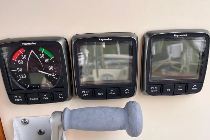 Slide: The Image of Raymarine instruments on 2000 Island Packet 350 sailboat dashboard. - 25