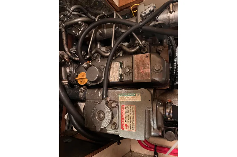 Slide: The Image of Engine compartment of a 2000 Island Packet 350 sailboat, showing detailed components. - 28