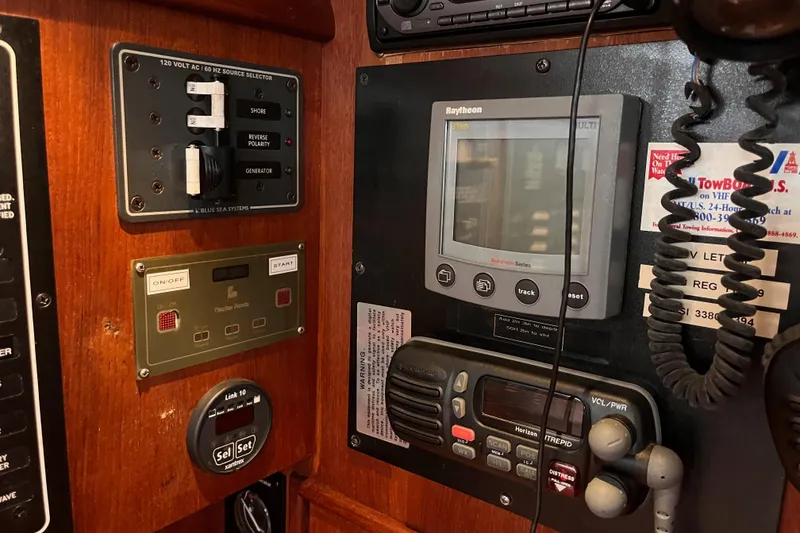 Slide: The Image of Control panel of a 2000 Island Packet 350 sailboat with navigation and communication equipment. - 31