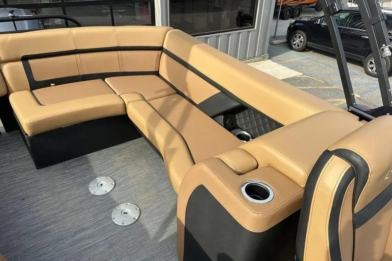 Slide: The Image of Luxurious seating on 2024 Godfrey AquaPatio 235 ULC iMPACT pontoon boat, featuring tan upholstery. - 12