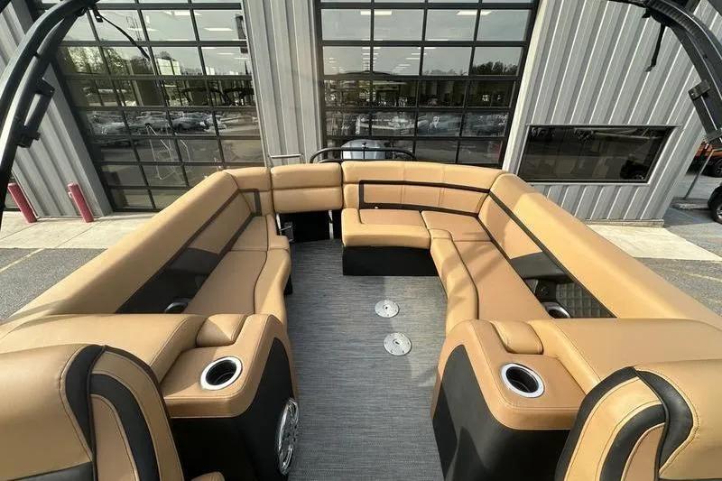 Slide: The Image of Luxurious seating on 2024 Godfrey AquaPatio 235 ULC pontoon boat, featuring tan upholstery. - 13
