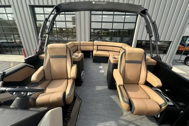 Slide: The Image of 2024 Godfrey AquaPatio 235 ULC iMPACT pontoon boat with luxurious seating and modern design. - 20