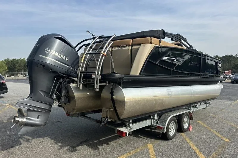 Slide: The Image of 2024 Godfrey AquaPatio 235 ULC pontoon boat on trailer with Yamaha outboard motor. - 6