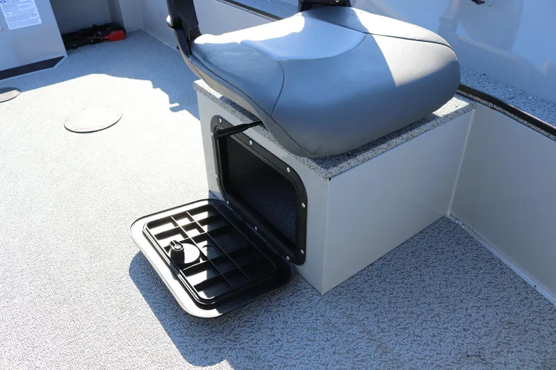 Slide: The Image of 2025 Smoker Craft Pro Lodge 160 boat seat with open storage compartment. - 12