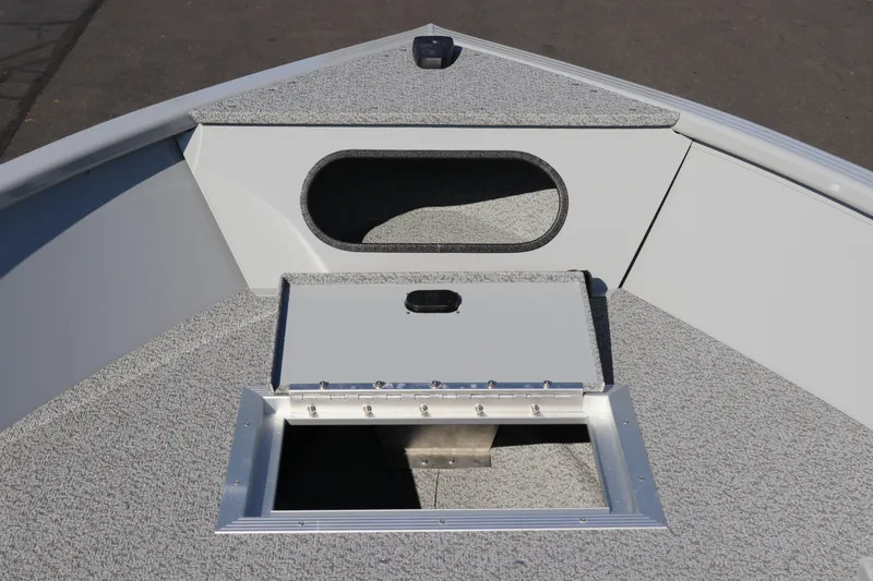 Slide: The Image of 2025 Smoker Craft Pro Lodge 160 boat interior with storage compartment. - 8