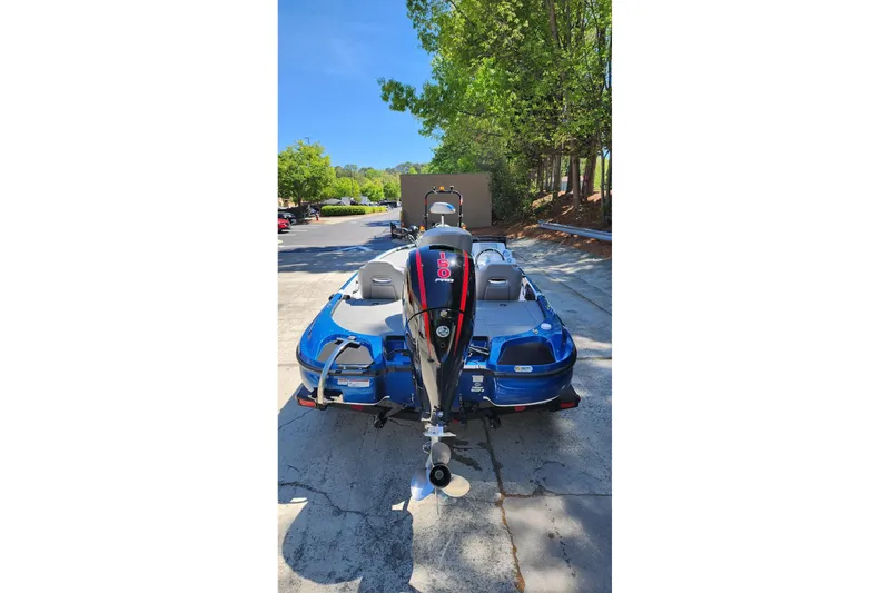 Slide: The Image of 2025 Nitro Z18 Pro boat with powerful outboard motor, parked outdoors. - 3