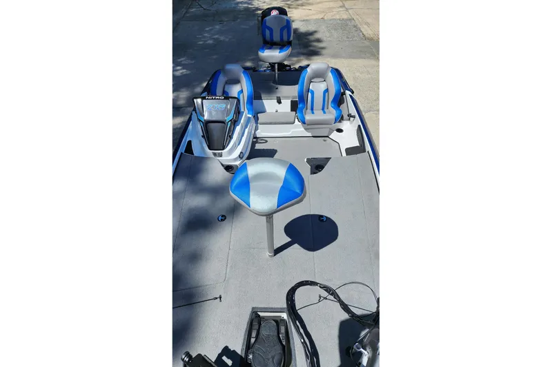 Slide: The Image of 2025 Nitro Z18 Pro boat interior with blue and gray seating and modern dashboard. - 5