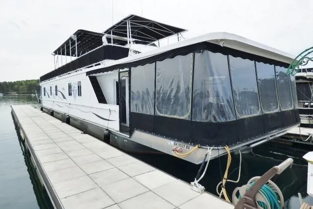 The Image of Houseboat docked at marina, Starlite 18x85 model, 2007, with covered upper deck. - 0