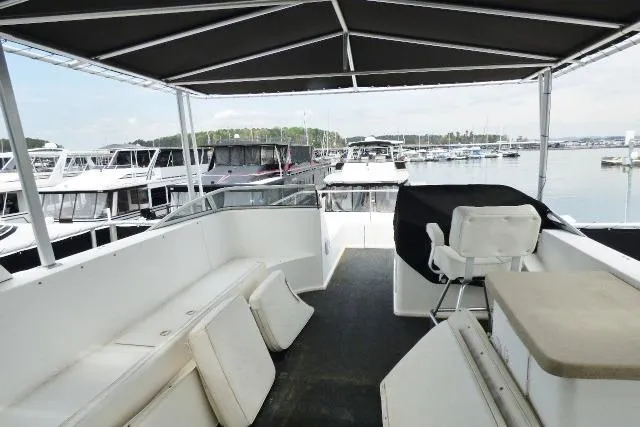 Slide: The Image of Spacious deck of 2007 Starlite 18x85 houseboat docked at marina. - 13