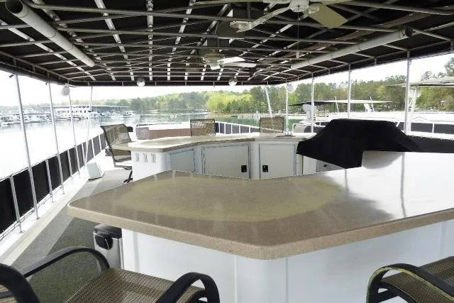 Slide: The Image of Spacious deck of 2007 Starlite 18x85 houseboat with bar and seating area. - 15