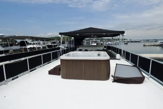 Slide: The Image of Rooftop deck of 2007 Starlite 18x85 houseboat with hot tub and canopy. - 16