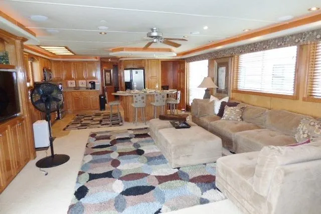 Slide: The Image of Luxurious Starlite 18x85 houseboat interior with modern kitchen, cozy seating, and stylish decor, 2007 model. - 2