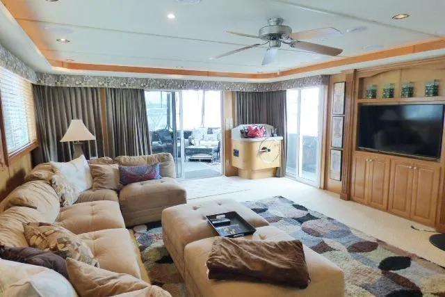 Slide: The Image of Luxurious living area in 2007 Starlite 18x85 houseboat with plush seating and entertainment center. - 3