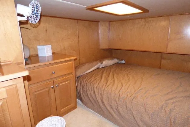 Slide: The Image of Cozy bedroom with wooden cabinetry in 2007 Starlite 18x85 houseboat. - 7