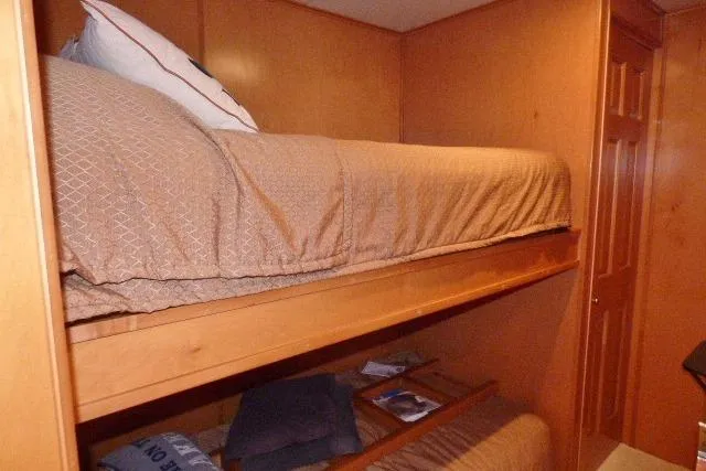 Slide: The Image of Bunk beds in a 2007 Starlite 18x85 houseboat with wooden interior. - 9
