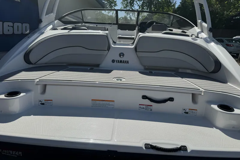 Slide: The Image of 2024 Yamaha Boats AR190 rear view, showcasing seating and swim platform. - 10