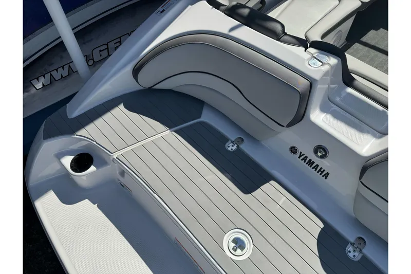 Slide: The Image of 2024 Yamaha Boats AR190 swim platform with sleek seating and modern design. - 12