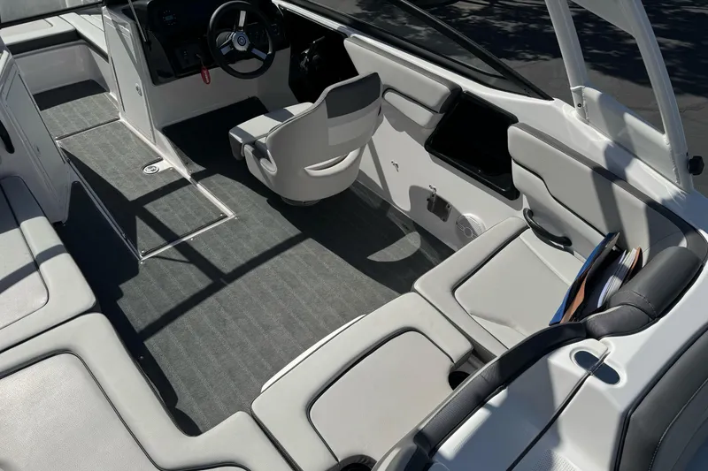 Slide: The Image of 2024 Yamaha Boats AR190 interior with sleek seating and modern dashboard design. - 14