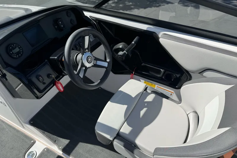 Slide: The Image of 2024 Yamaha Boats AR190 cockpit with steering wheel and control panel. - 16