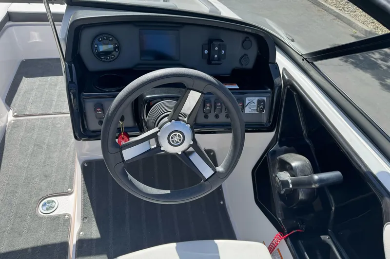 Slide: The Image of 2024 Yamaha Boats AR190 steering console with modern controls and dashboard. - 17