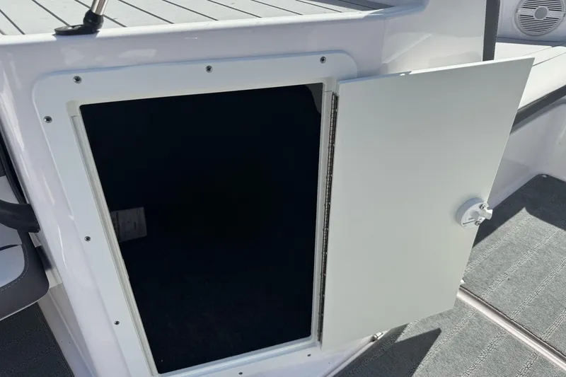 Slide: The Image of Open storage compartment on a 2024 Yamaha Boats AR190, showcasing interior space. - 20