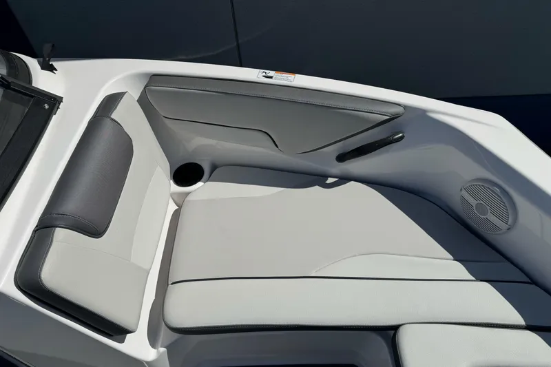 Slide: The Image of 2024 Yamaha Boats AR190 interior seating with cup holder and speaker. - 24