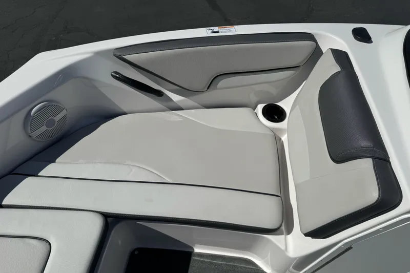 Slide: The Image of 2024 Yamaha AR190 boat interior seating with speaker and cup holder. - 25