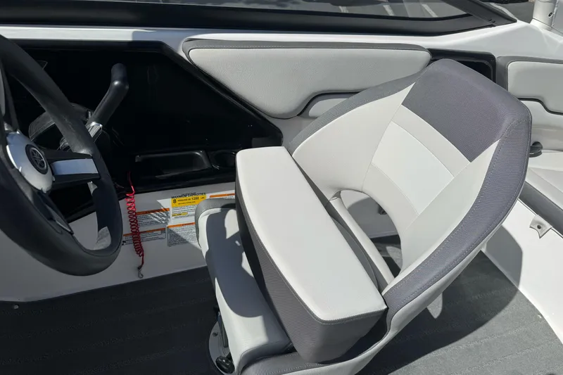 Slide: The Image of 2024 Yamaha Boats AR190 interior with steering wheel and cushioned seat. - 31