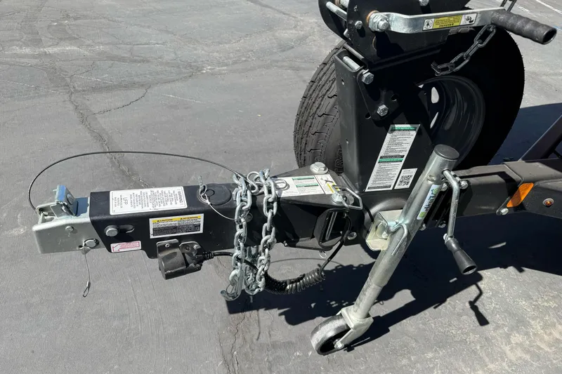 Slide: The Image of Trailer hitch and wheel assembly for 2024 Yamaha Boats AR190 on pavement. - 8