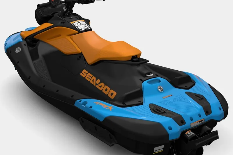 Slide: The Image of 2026 Sea-Doo Spark Trixx jet ski, black and blue design with orange seat. - 6