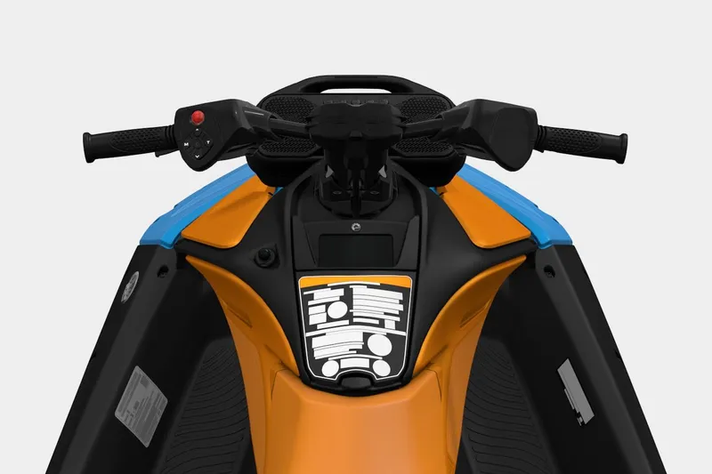 Slide: The Image of 2026 Sea-Doo Spark Trixx handlebars, vibrant orange and blue design, close-up view. - 7