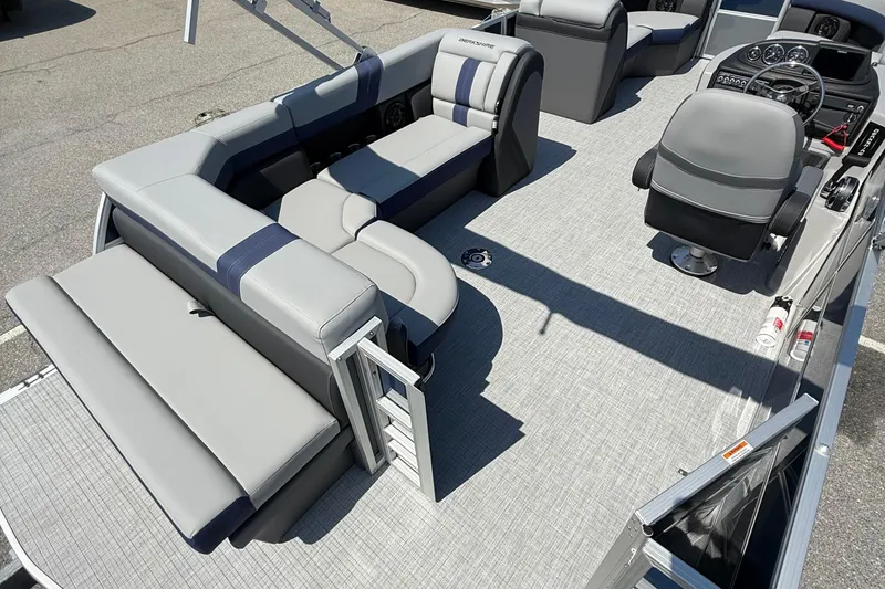 Slide: The Image of 2026 Berkshire 22CL2 CTS pontoon boat interior with gray seating and modern dashboard. - 12