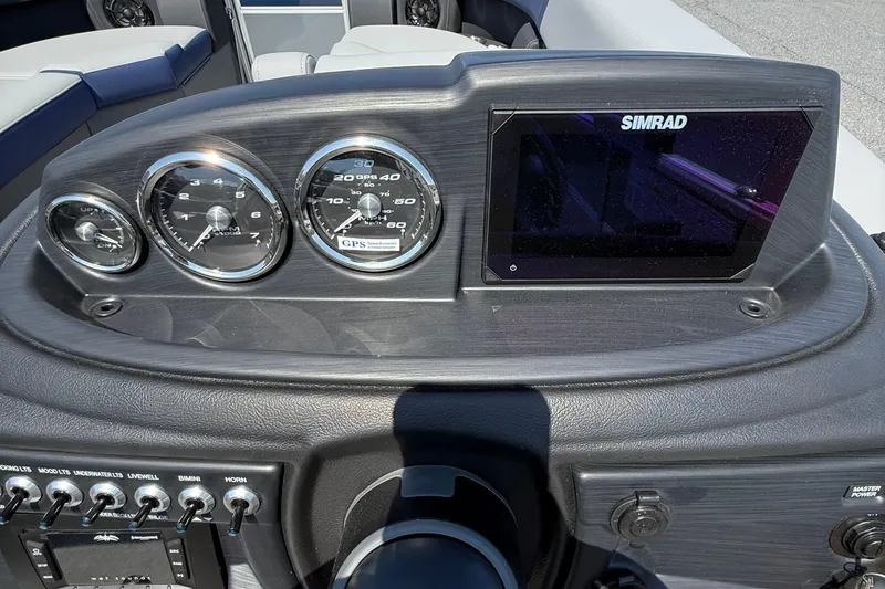 Slide: The Image of Dashboard of 2026 Berkshire 22CL2 CTS boat with gauges and Simrad display. - 14