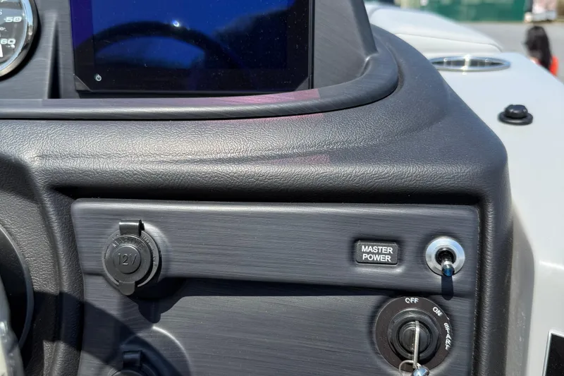Slide: The Image of Dashboard of 2026 Berkshire 22CL2 CTS boat with master power switch and 12V outlet. - 16