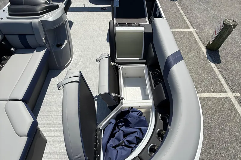 Slide: The Image of 2026 Berkshire 22CL2 CTS boat interior with open storage compartments and seating. - 17
