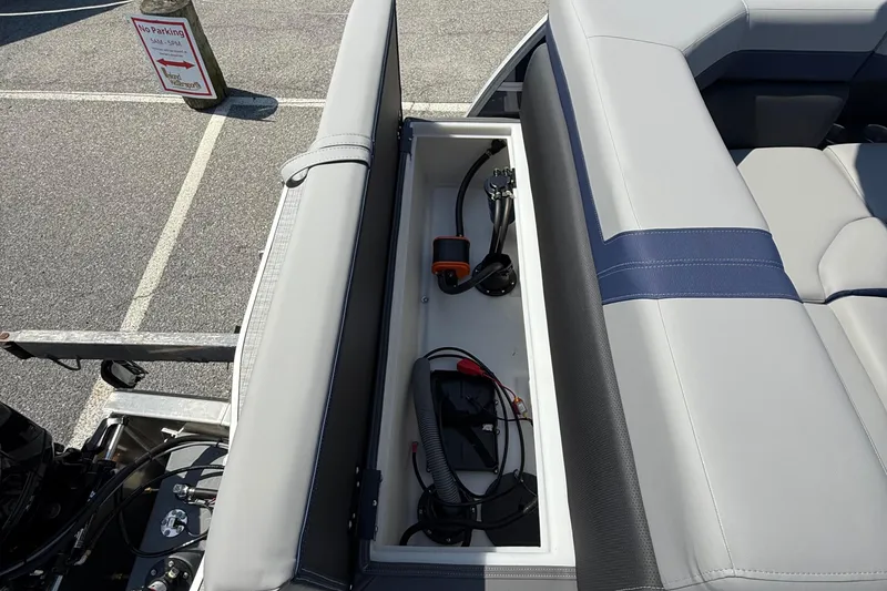 Slide: The Image of Storage compartment in a 2026 Berkshire 22CL2 CTS boat with equipment inside. - 19