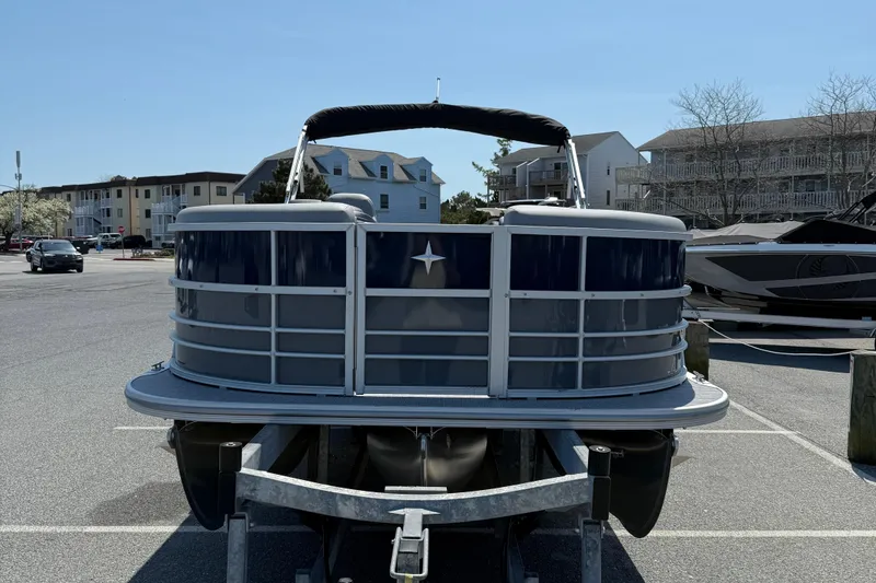 Slide: The Image of 2026 Berkshire 22CL2 CTS pontoon boat on trailer in parking lot. - 3
