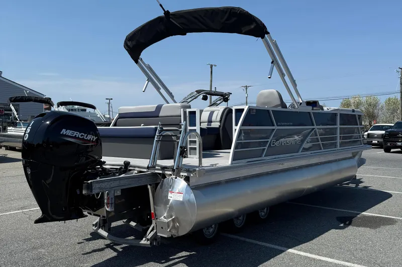 Slide: The Image of 2026 Berkshire 22CL2 CTS pontoon boat with Mercury engine in parking lot. - 8