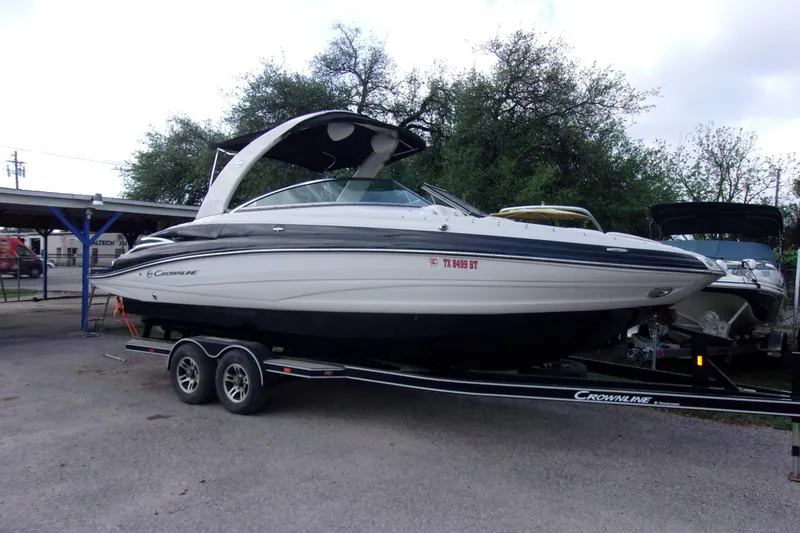 The Image of 2013 Crownline Eclipse E6 boat on trailer, parked outdoors. - 1