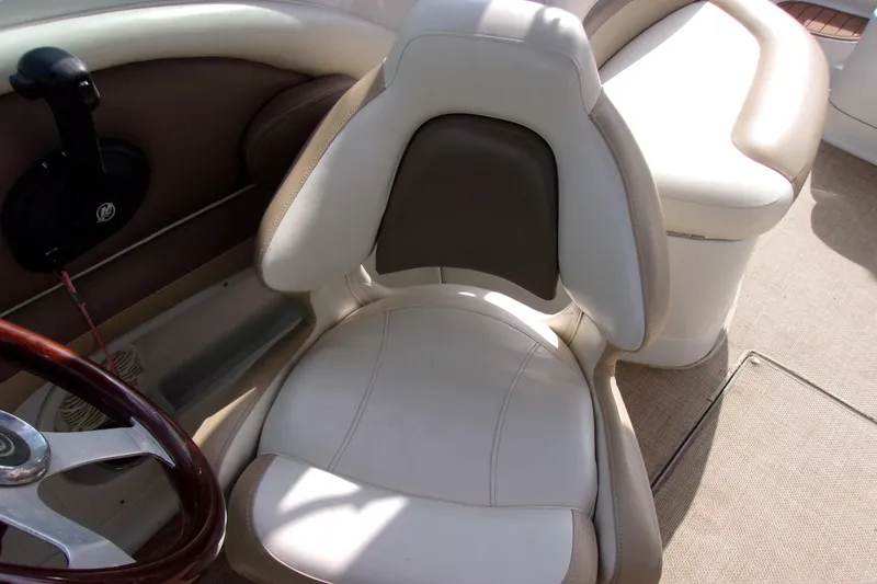 Slide: The Image of 2013 Crownline Eclipse E6 boat interior with beige and brown seating. - 12