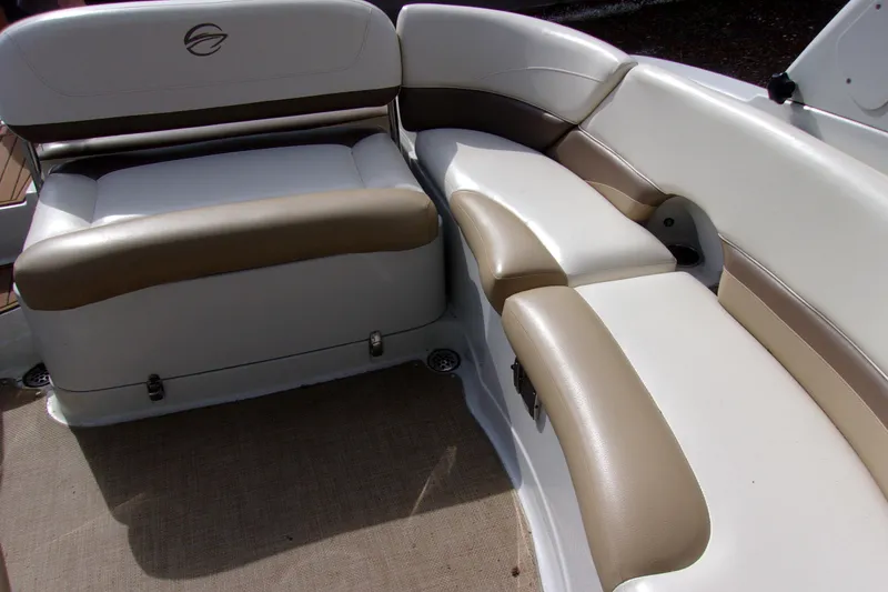 Slide: The Image of 2013 Crownline Eclipse E6 boat interior with beige and white seating. - 14