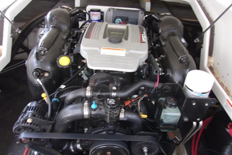 Slide: The Image of 2013 Crownline Eclipse E6 engine compartment showcasing a powerful inboard motor. - 17