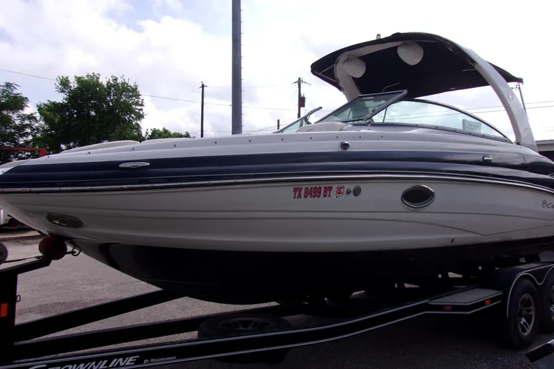 Slide: The Image of 2013 Crownline Eclipse E6 boat on trailer, side view with canopy. - 3