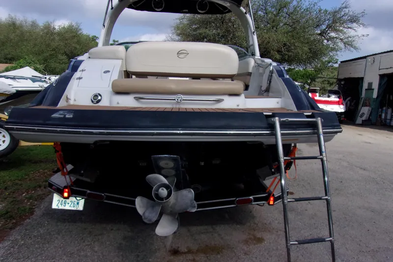 Slide: The Image of 2013 Crownline Eclipse E6 boat rear view with ladder and propeller. - 4