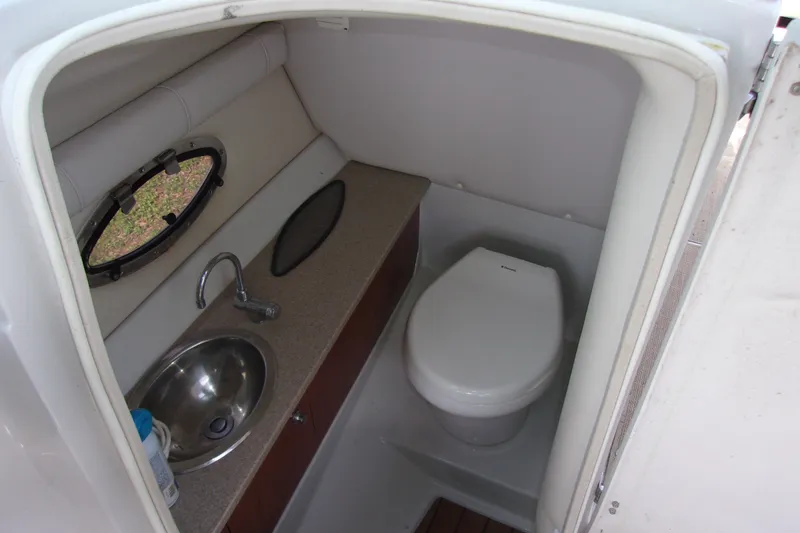 Slide: The Image of 2013 Crownline Eclipse E6 boat bathroom with sink and toilet. - 8