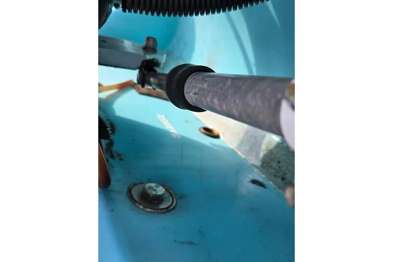 Slide: The Image of Close-up of 1972 Boston Whaler 17 Montauk boat interior, showing steering mechanism. - 14