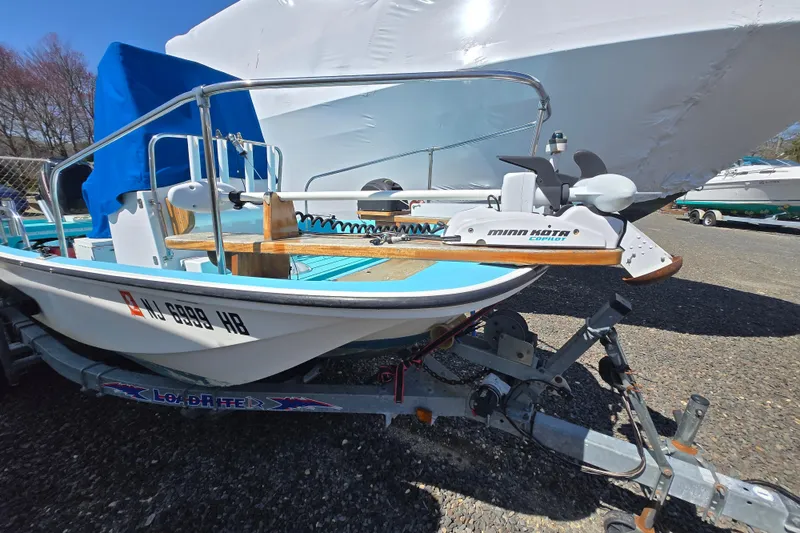 Slide: The Image of 1972 Boston Whaler 17 Montauk boat on trailer, featuring Minn Kota motor. - 15