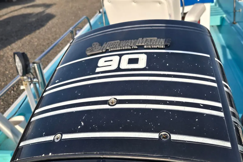 Slide: The Image of Outboard motor on a 1972 Boston Whaler 17 Montauk boat, featuring a 90 horsepower engine. - 16