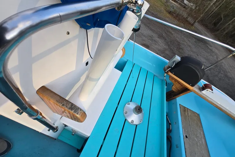 Slide: The Image of 1972 Boston Whaler 17 Montauk interior with blue deck and fishing rod holder. - 20